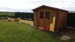 Abri de jardin 9m² PLUS en bois 40mm traité teinté marron Gardy Shelter