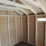 Garage en bois brut 17m² – panneaux LP® SmartSide® – Timbela